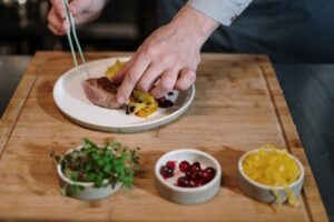 man serving dish