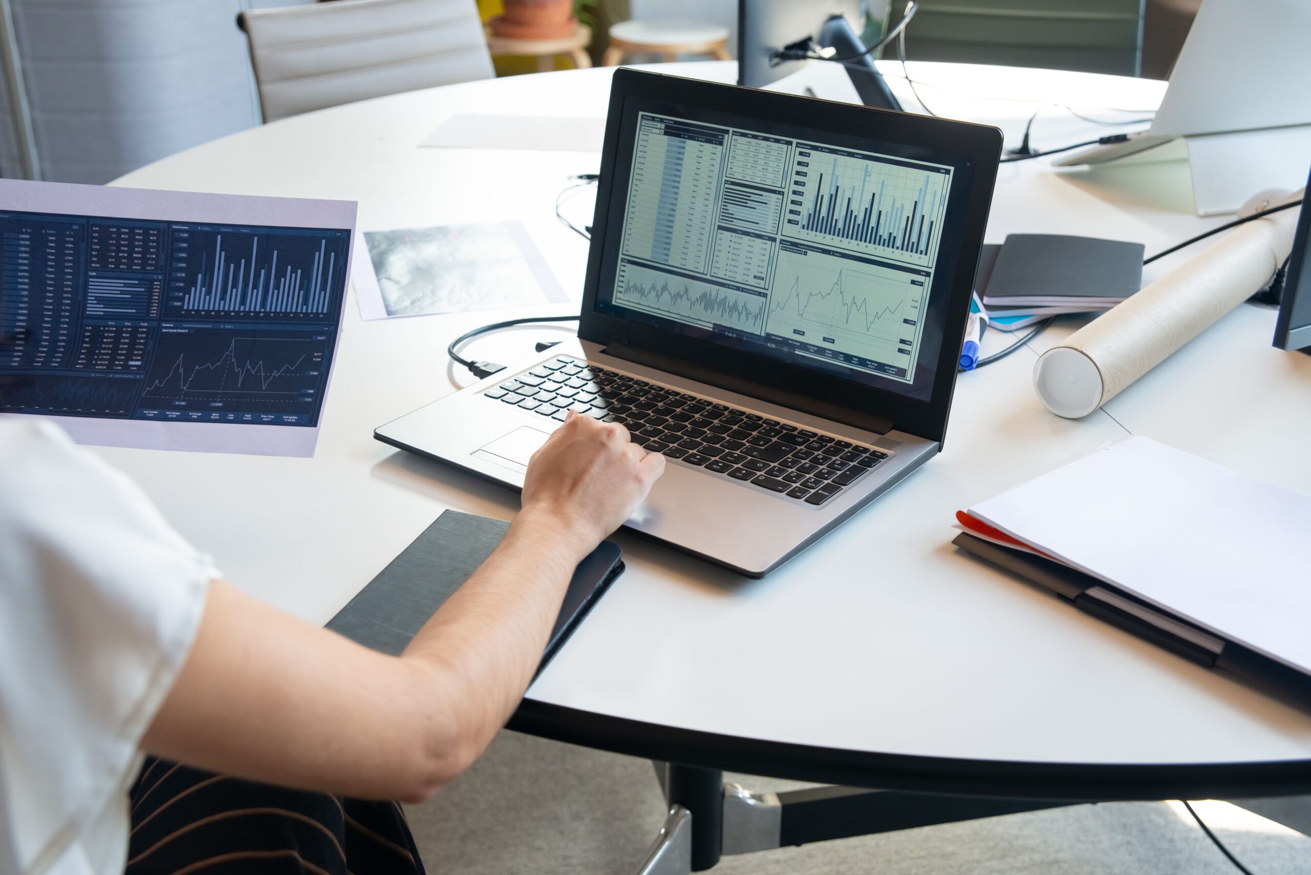 a man analysing data on a laptop