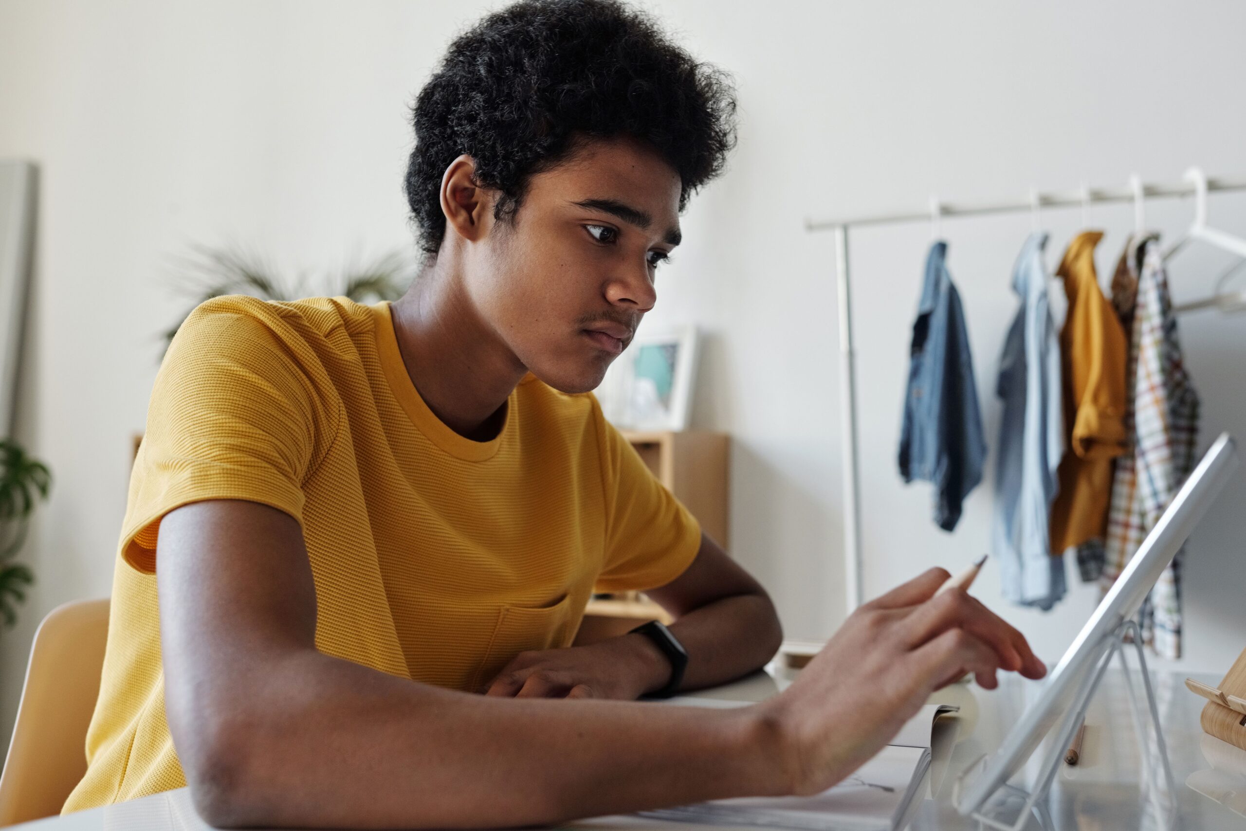 Teenage boy engaged in online